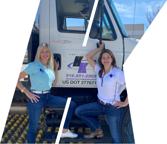 Two women in front of a truck door