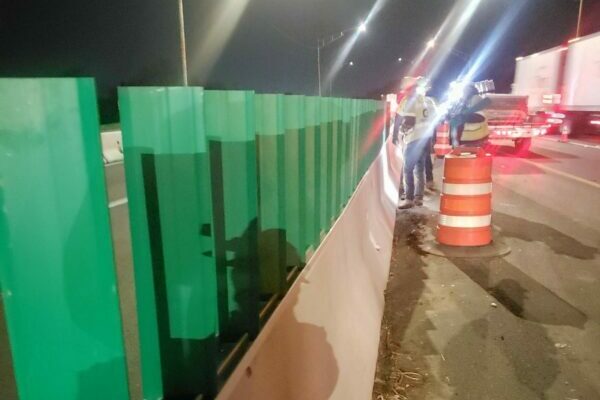 green barriers on the side of the road